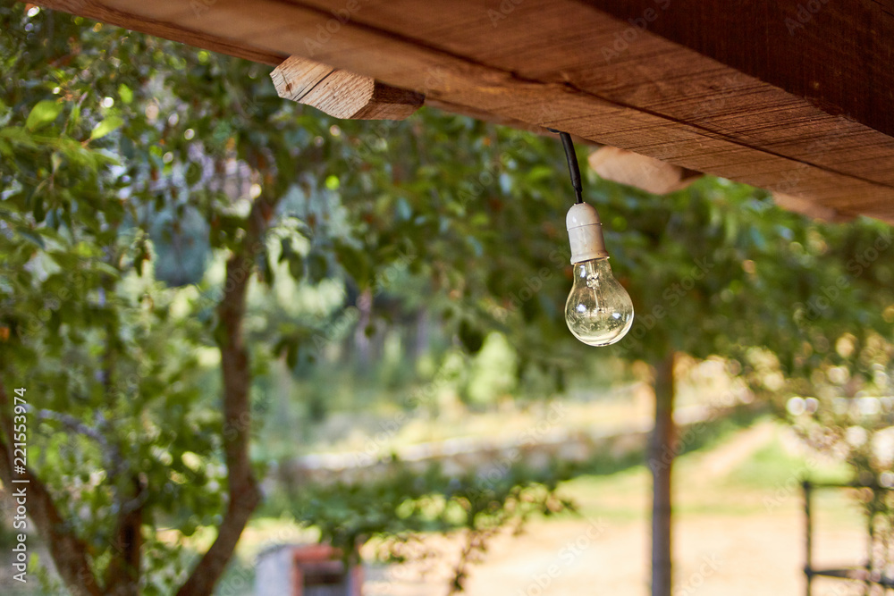 Fototapeta premium Bulb hangs from the cabin ceiling