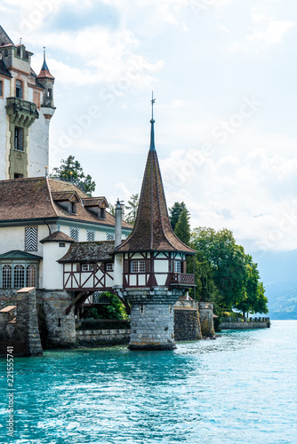 Oberhofen Castle with Thun Lake background in Switzerland photo