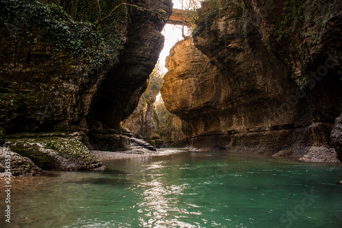 Beautiful landscape of azure green river flowing among rocks in Martvili canyon