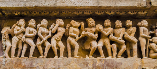 Photos Stone carved bas-relief with dancers and musicians in erotic scenes, Kahjuraho t