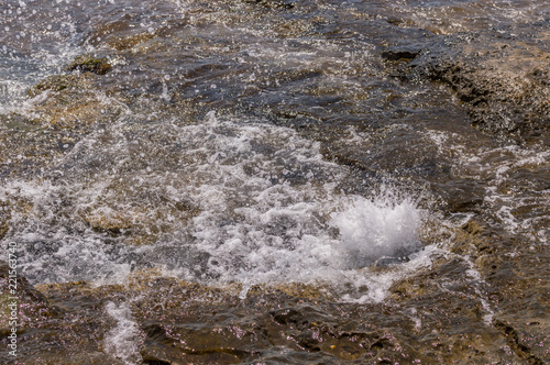Sea water splashing on the rock © Spike @ Neural Act.