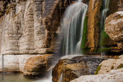 Beautiful waterfall flowing down the high rock in Martvili canyon