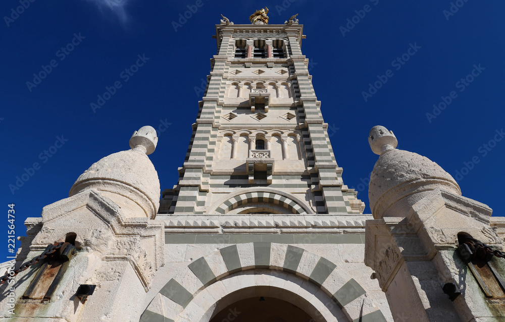 The scenic stone bell tower of Notre Dame de la Garde Basilica, Marseille, France.