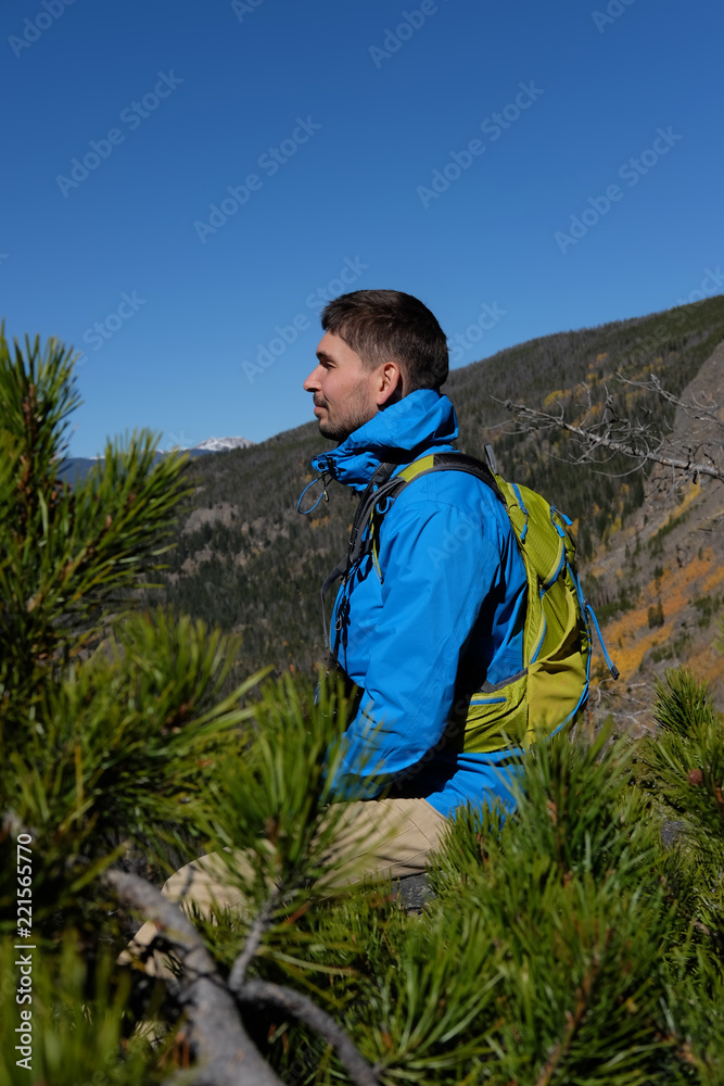 Backpacker hiker tourist in Rocky Mountains