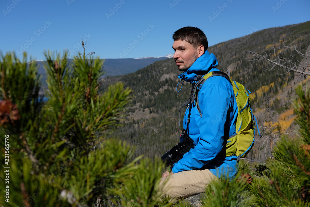 Backpacker hiker tourist in Rocky Mountains Backpacker hiker tourist in Rocky Mountains