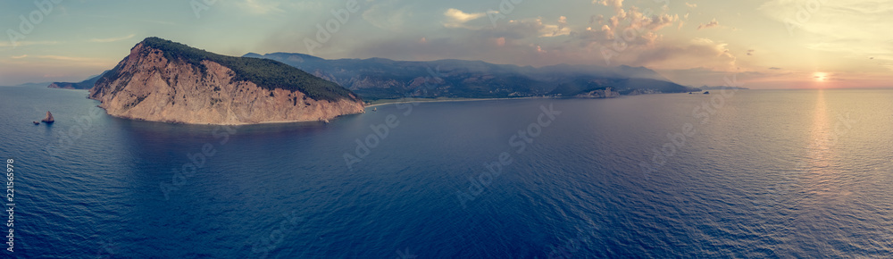 Spectacular aerial view of coastline at sunset.