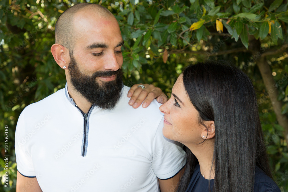 bearded man in love pretty brunette girl in park bearded man in love pretty brunette girl in park
