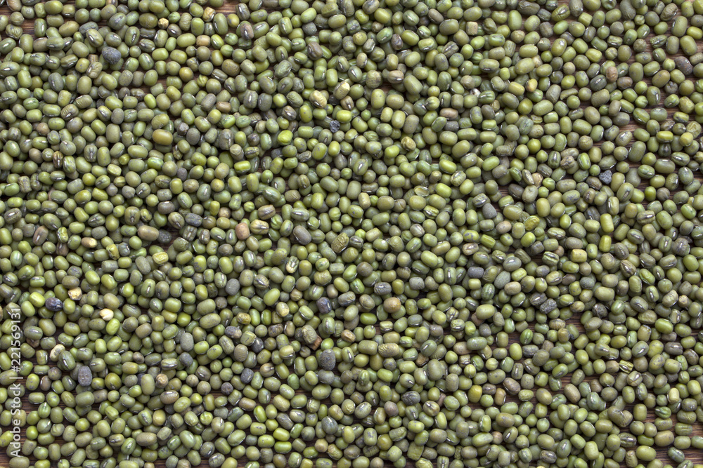 green chickpeas seeds on a wooden background green chickpeas seeds on a wooden background