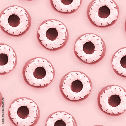 Many small plastic donuts lies on a pastel colorful background. Flat lay minimal pattern. Top view photo