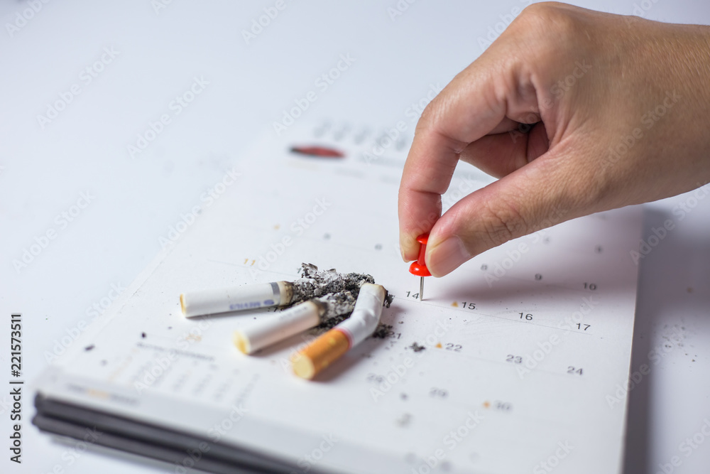 Cigarette on the calendar Concept of quitting smoking Cigarette on the calendar Concept of quitting smoking