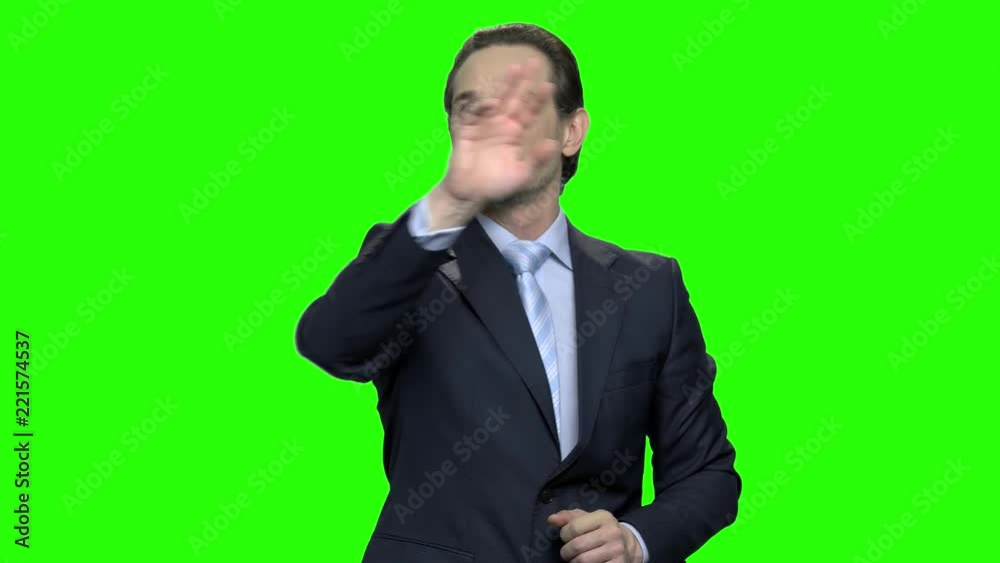 Business man using futuristic touchscreen display. People and future technology concept. Green screen hromakey background for keying. Business man using futuristic touchscreen display. People and future technology concept. Green screen hromakey background for keying.