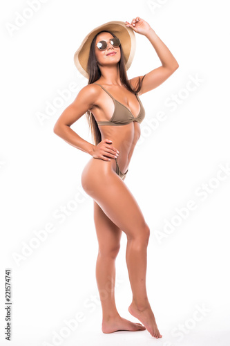Full-length portrait of pretty female wearing fashion bikini and sunglasses, isolated on white background