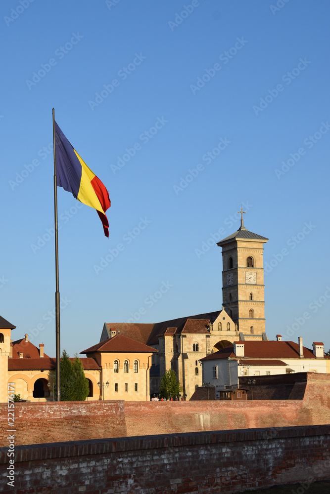 Catholic St. Michael's Cathedral, with Romanian flag. Alba Iulia in Transylvania, Romania