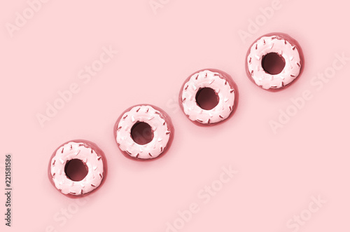 Many small plastic donuts lies on a pastel colorful background. Flat lay minimal pattern. Top view photo