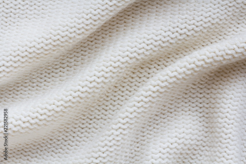 beige knitted fabric background. reverse stockinette stitch pattern