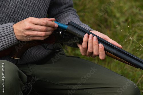Hunter reloads hunting rifle