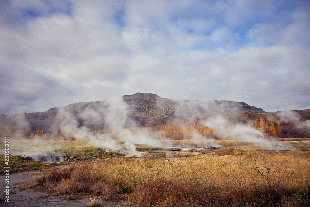 steam from geysers in Iceland in autumn