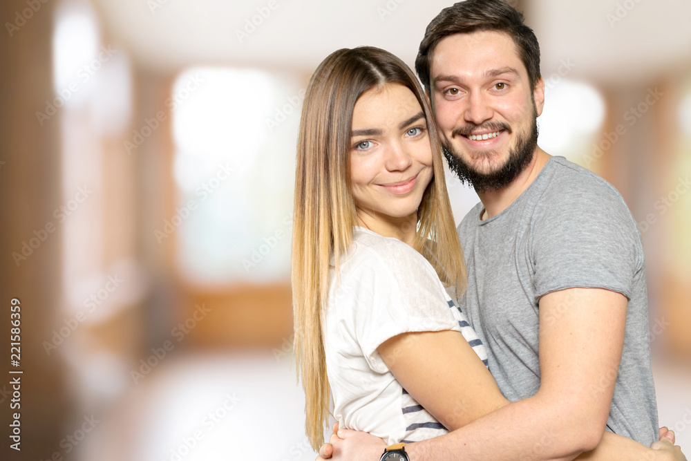 Happy Smiling Couple in love indoors portrait