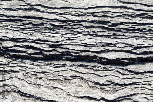 river bed natural gray dry shale rock layers pattern