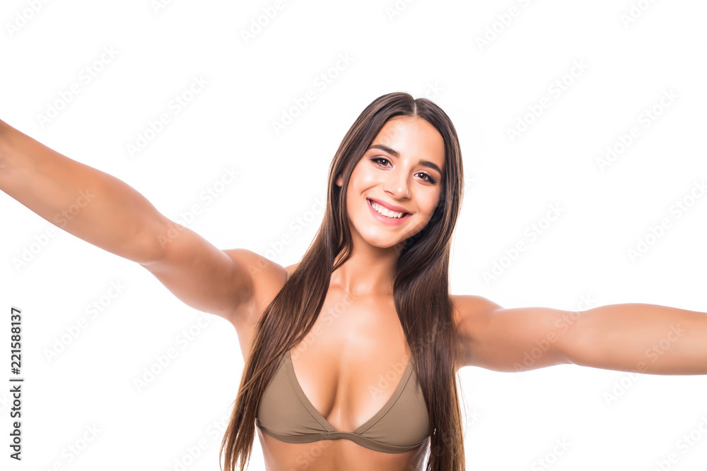 Hey there. Closeup portrait of beautiful pretty cute lady taking making selfie isolated white background Hey there. Closeup portrait of beautiful pretty cute lady taking making selfie isolated white background