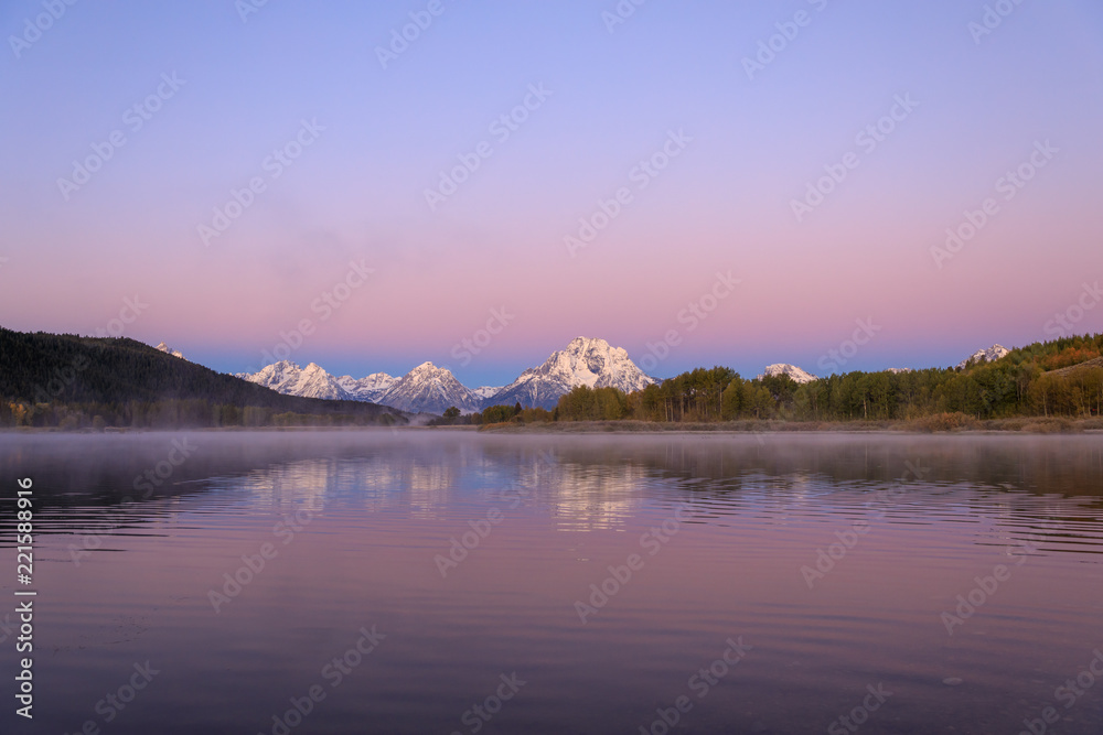 Fototapeta premium Sunrise Reflection of the Tetons in Autumn
