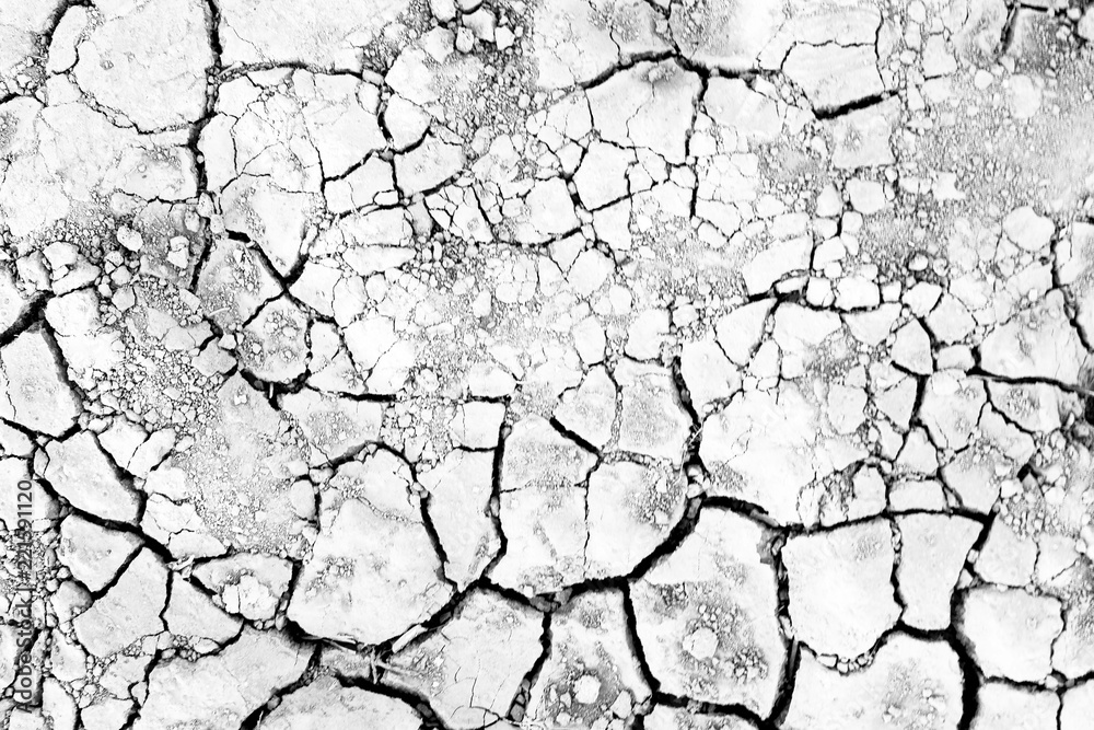 Dry soil texture background. Arid climate. surface detail, top view arid soil is dried and broken with large cracks