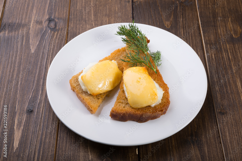 Fried toasts with baked egg and cheese Fried toasts with baked egg and cheese