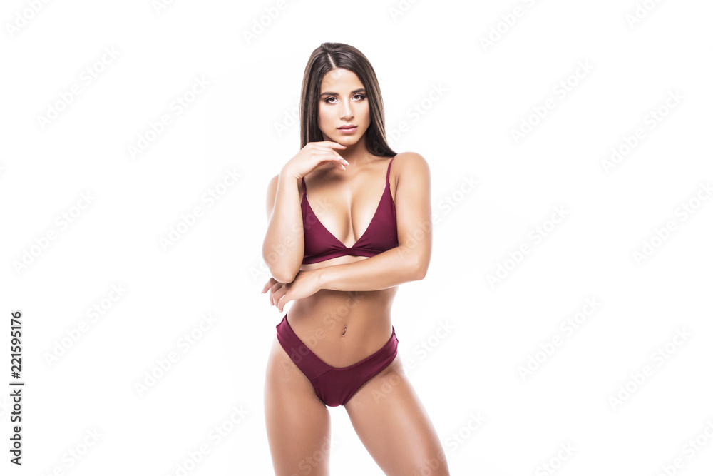 Sexy busty young brunette woman in a bikini isolated on white background - obrazy, fototapety, plakaty 