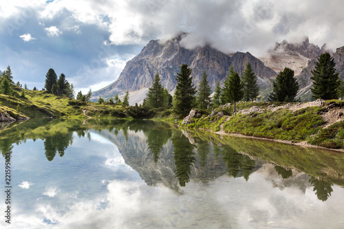 Lago di Limides — a tiny lake hidden in the heart of the Dolomites. The lake is surrounded by mountains which reflecting in it. South Tyrol, Alps, Italy.  photo