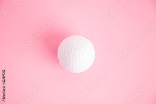 golf ball on pink background