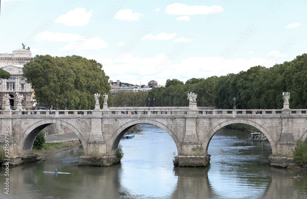 a wide river Tiber and the Roman bridge. Italy