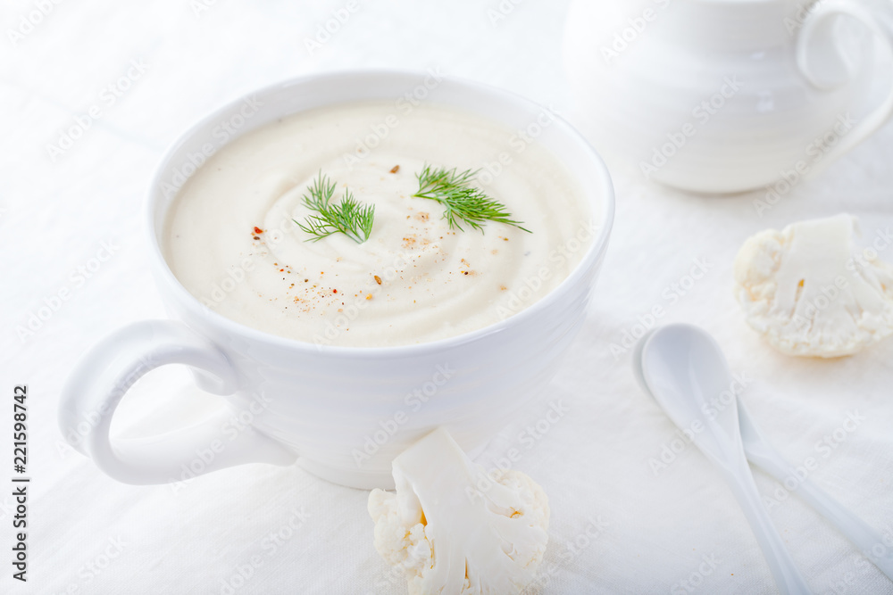 Cauliflower soup on a white background. Healthy food. Cauliflower soup on a white background. Healthy food.