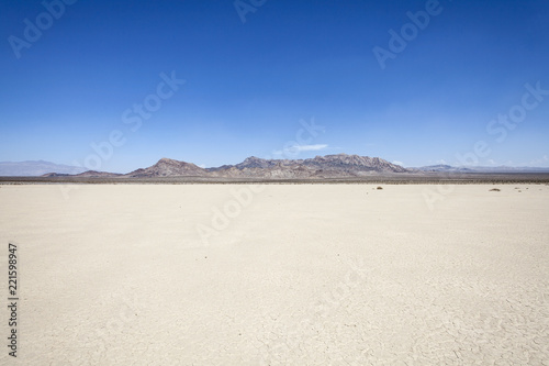 Silurian dry mud flat lake bed near Death Valley in California's vast Mojave desert.   photo