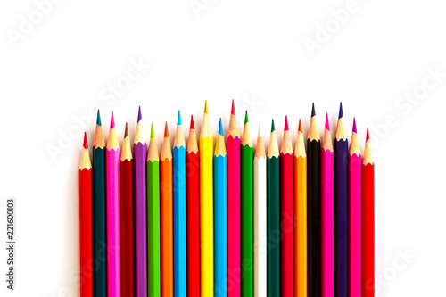 Color pencils are arranged in the form of a wavy line with a pointed side on a white background. background is isolated