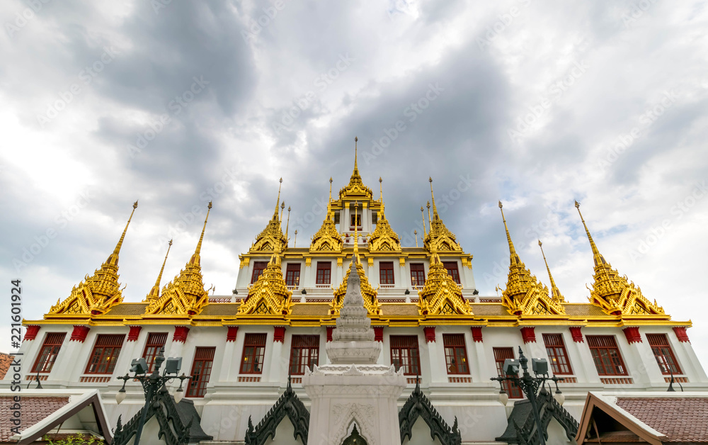Naklejka premium Loha Prasat , The metallic castle covered with gold leaf at of Wat Ratchanadda Temple in Bangkok, Thailand.