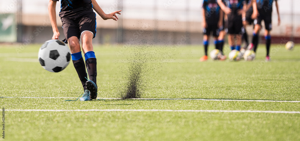 Obraz premium Young children player on the football match