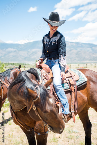 Cowgirl Smiles on Horseback