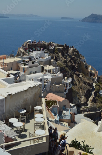 Picturesque Houses & Castle With The Aegean Sea In The Infinite After An Increibe Lookout In Oia On The Island Of Santorini. Architecture, landscapes, travel, cruises Greece. photo