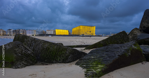 SAN SEBASTIAN, SPAIN - SEPTEMBER 5, 2018: Kursaal auditorium illuminated, place where all kinds of events are held, such as small meetings, congresses, conferences, fairs and shows. photo