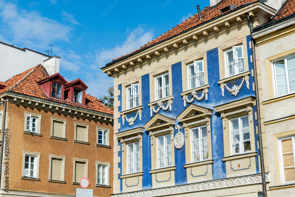 Warsaw / Poland - August 20 of 2018 : Street with colorful houses in Warsaw city. European architecture of old town in Poland. Concept of travel and city landscape.