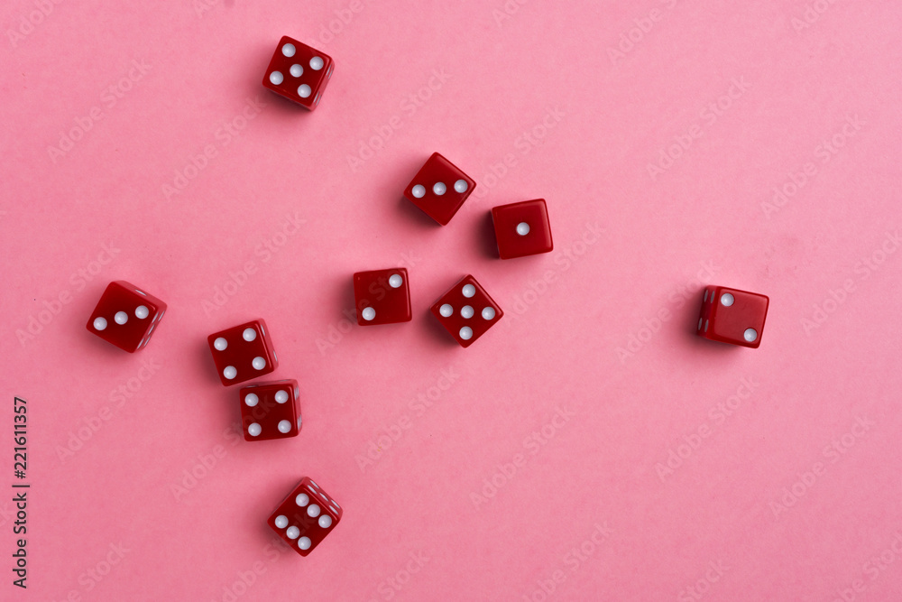 Red gaming dices on pink background. Flat lay, place for text. Game concept Red gaming dices on pink background. Flat lay, place for text. Game concept