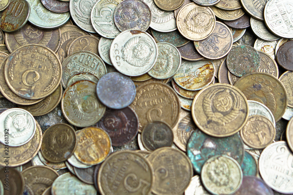 Soviet coins sprinkled on the whole frame of the photo. The USSR ruble. Old coins for numismatics. Soviet coins sprinkled on the whole frame of the photo. The USSR ruble. Old coins for numismatics.