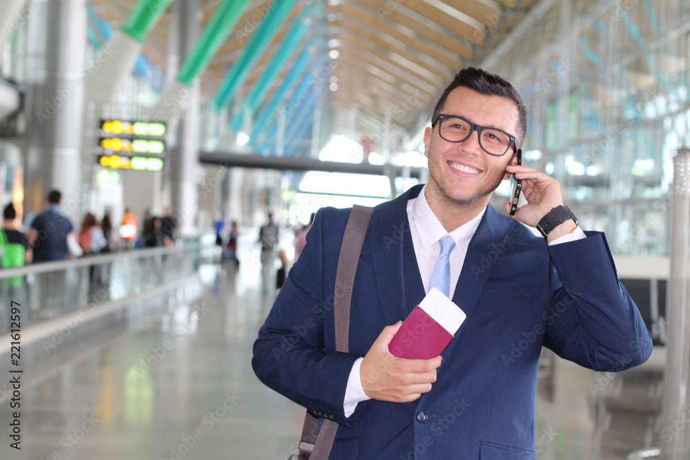Global business concept with business man on his cell phone isolated at the airport Global business concept with business man on his cell phone isolated at the airport