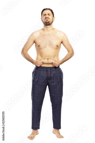 Man without clothes, in shorts, isolated on white background photo
