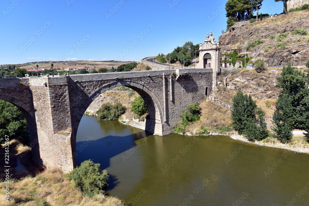 Alcantara Bridge ( Puente de Alcantara ) is an arch bridge in Toledo, Spain, spanning the Tagus River