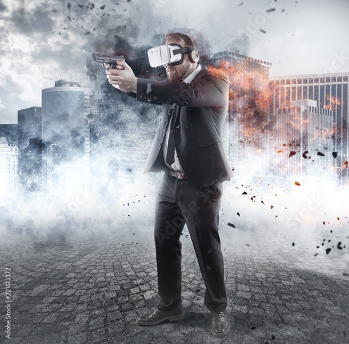 Businessman is playing a game wearing virtual reality glasses and holding a gun