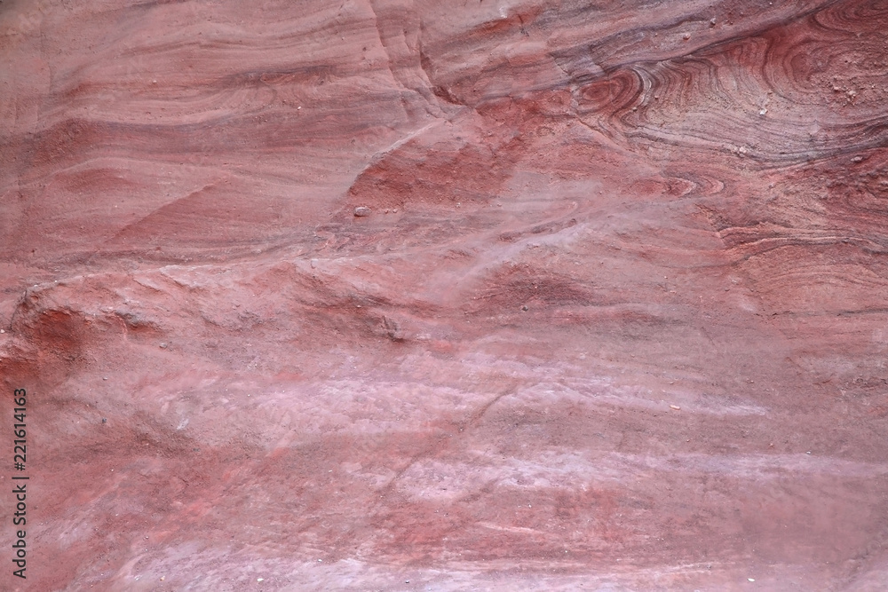 Texture of red sandstone. Background from the structure of mountains in a Great Red Canyon in Israel.
