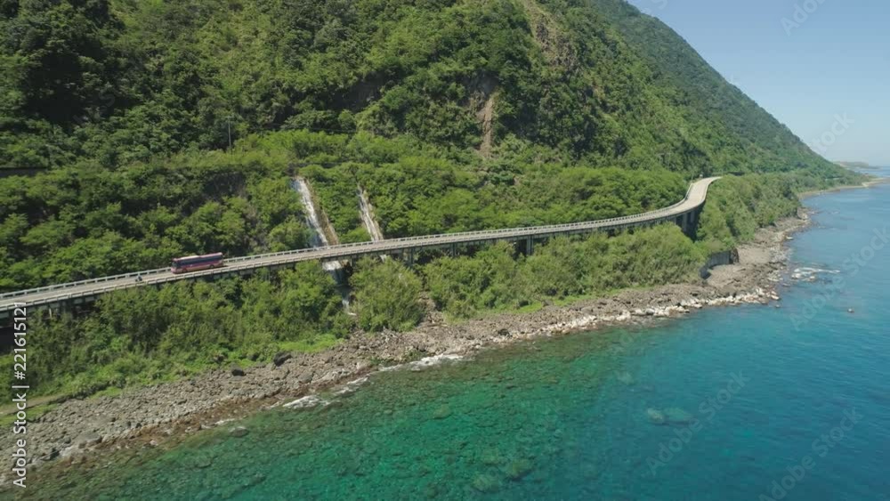 Aerial view of Patapat viaduct in the coast of Pagudpud, Ilocos Norte. Highway with bridge by coast sea near the mountains. Philippines, Luzon. Aerial view of Patapat viaduct in the coast of Pagudpud, Ilocos Norte. Highway with bridge by coast sea near the mountains. Philippines, Luzon.