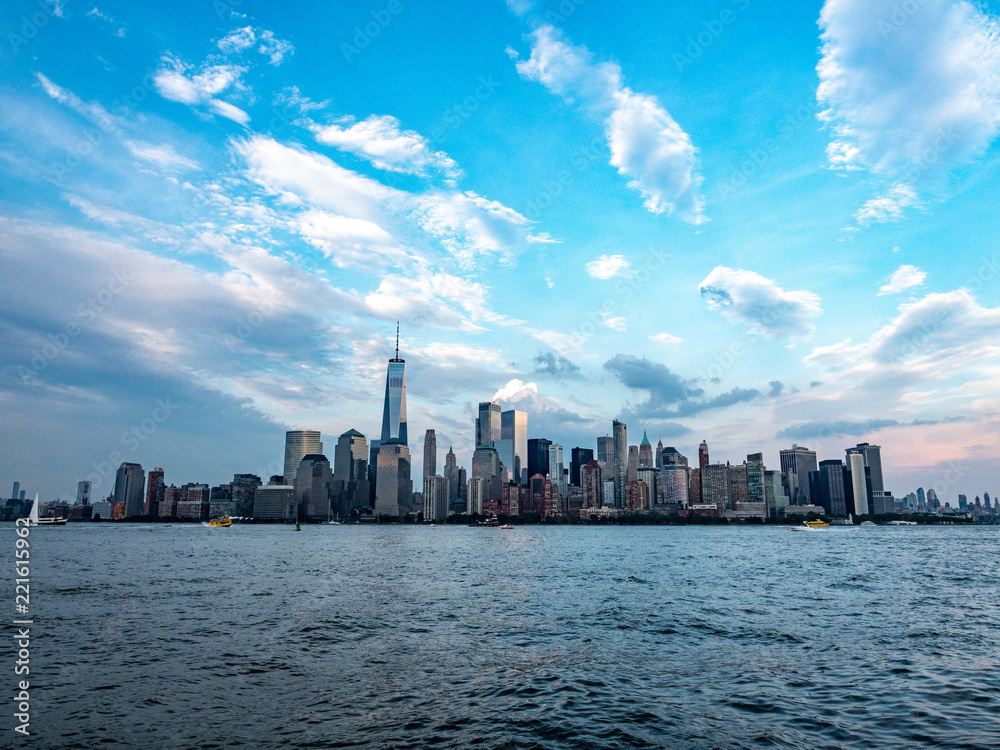 wide angle view of Manhattan skyline across Hudson river