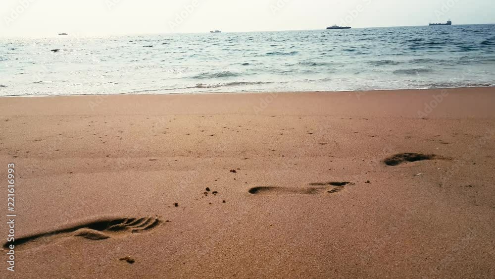 Footprints on sand beach, Cabo Ledo, Angola Footprints on sand beach, Cabo Ledo, Angola